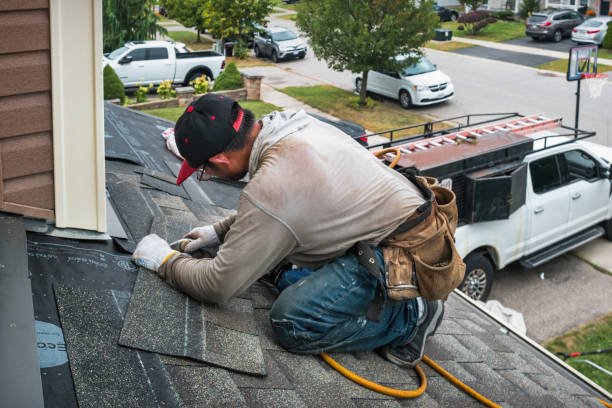 Professional Storm Damage Roof Repair technician working in Ames, TX